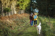 © Daniel Gonzalez/Stocksy - Traveling couple with dog in forest
