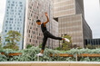 © Alba Vitta/Stocksy - Stylish man dancing and balancing  in office building