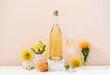 © Nadine Greeff/Stocksy - Champagne bottle still life with flowers