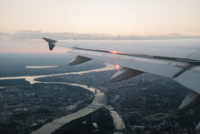 Airplane Wing Over Landscape And River