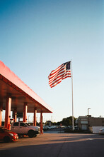 Gas Station And Large US Flag