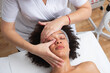© Aleksandra Jankovic/Stocksy - Woman Having A Face Massage At The Beauty Salon