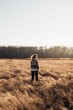 © Liliya Rodnikova/Stocksy - Carefree woman in autumn field