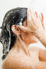 Woman Taking A Shower With Soap