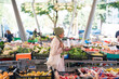 © Studio Marmellata/Stocksy - Arab female using smartphone on market