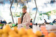 © Studio Marmellata/Stocksy - Muslim female selecting cherry tomatoes