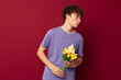 © Tatiana - A young man red hair in casual wear bouquet of flowers gift Lifestyle unaltered