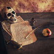 Mystic still life with skull, books and candles..