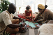 © Clique Images/Stocksy - Family Preparing For Kwanzaa