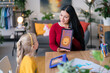 © Studio Marmellata/Stocksy - Cheerful woman and girl studying together