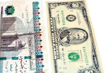 Old American 50 fifty dollars banknote with 100 one hundred Egyptian pounds bill isolated on a white background, Selective focus of Egyptian and American money exchange rate