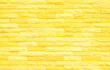 © Phokin - Brick wall painted with yellow paint pastel bright tone texture background. Brickwork and stonework flooring interior with rock old pattern clean grid concrete uneven bricks design backdrop.
