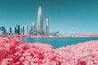 © Heng Yu/Stocksy - Infrared photography of plants with cityscape by sea