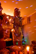 © Ivan Andrianov/Stocksy - Woman in sequins dress at home party