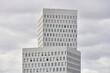 © Guille Faingold/Stocksy - Modern buildings on cloudy sky.