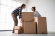 © Studio Marmellata/Stocksy - Multiracial couple moving in new flat