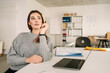 © contrastwerkstatt - Young businessswoman mulling over a new idea