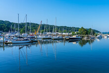 Yachts, Ships And Boats, Large And Small, Are Neatly Lined Up By The Marina In The Atlantic Gulf In The Early Morning.