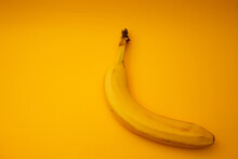 Yellow Banana Lies On A Bright Background