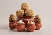 Til Gul OR Sweet Sesame Seed Ball Or Laddu With Fikri For Indian Festival Makar Sankranti Over White Background.