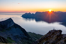 Person Admiring The Fjord At Dawn Standing On Top Of Husfjellet Mountain, Senja Island, Troms County, Norway, Scandinavia