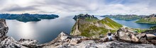 Man With Camera Photographing Hesten And Inste Kongen Mountains Standing On Segla Peak, Senja Island, Troms County, Norway, Scandinavia