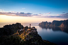 Person Contemplating Sunset From Top Of Mountains, Senja Island, Troms County, Norway, Scandinavia
