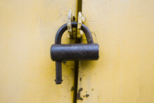 Old Vintage Iron Lock On   Yellow Door