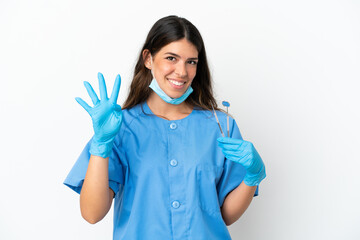 Dentist woman holding tools over isolated white background happy and counting four with fingers