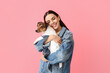 © Pixel-Shot - Happy young woman with cute dog on pink background
