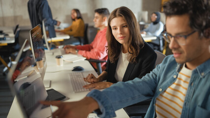 Fototapete - Diverse Multiethnic Group of Female and Male Students Sitting in College Room, Collaborating on School Projects on a Computer. Young Scholars Study, Talk, Apply Academic Skills and Knowledge in Class.