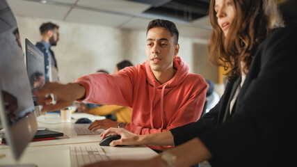 Fototapete - Diverse Multiethnic Group of Female and Male Students Sitting in College Room, Collaborating on School Projects on a Computer. Young Scholars Study, Talk, Apply Academic Skills and Knowledge in Class.