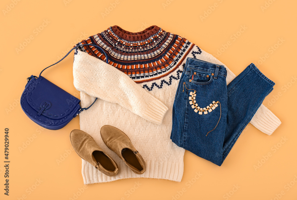 Stylish clothes, accessories and shoes on color background