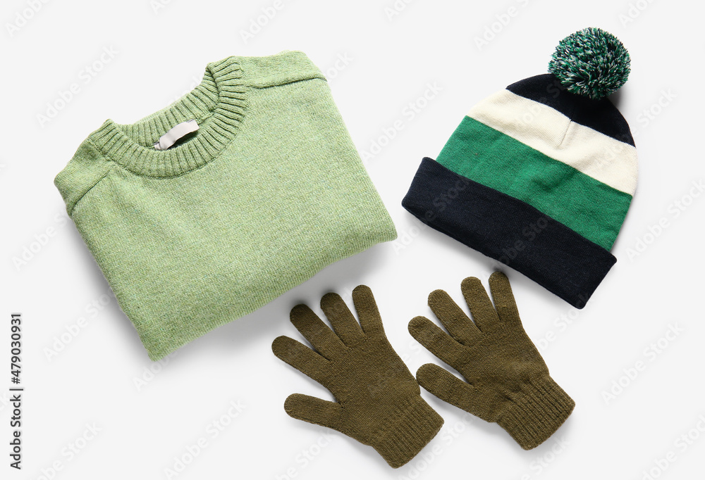 Male sweater, hat and gloves on white background