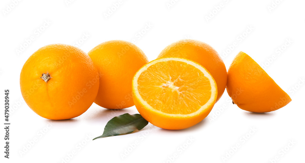 Fresh ripe cut oranges on white background
