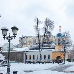 Wall Mural - Moscow, Russia, the temple of the Holy Wonderworkers Cosmas and Damian in the Christmas holidays. In Stoleshnikov lane the Church kindly opened the gate for its parishioners.