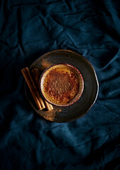 Wall Mural - Cup of coffee with milk and cinnamon. Top view