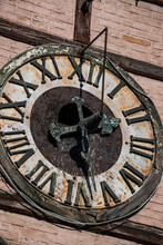 Clock Face On Old Wooden Tower Close Up. Ukraine, Chortkiv