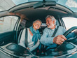© Daniel - Couple of two happy senior having fun and enjoying vacations trip together driving and discovering new places with a car.