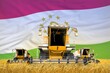 industrial 3D illustration of four orange combine harvesters on grain field with flag background, Tajikistan agriculture concept