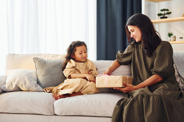 Conception of parent love. Mother and her daughter spending time together at home