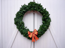 Large Wreath Hangs On A Barn Door On The Island Of Nantucket