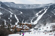 View from Spruce Peak to Stowe Mountain Resort Village and ski trails at Peak Mansfield.
