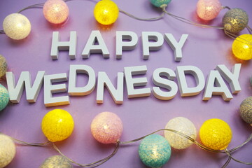 Poster - Happy Wednesday alphabet letters with LED cotton balls on purple background