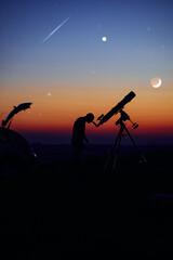 Wall Mural - Silhouette of a man, car, telescope and countryside under the starry skies.