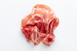 Italian prosciutto crudo or jamon. Raw ham. Isolated on white background.
