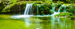 closeup small waterfall on mountain river, summer outdoor travel scene