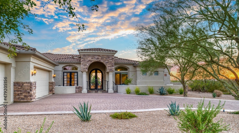 A luxury home at sunset Stock Photo | Adobe Stock