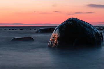 Wall Mural - Baltic Sea rocks and beach sand at sunset