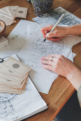 Wall Mural - astrology. astrologer calculates natal chart and makes a forecast of fate tarot cards, fortune telli